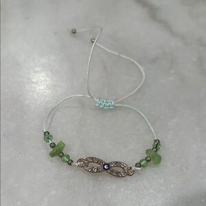 Elegant Green and Gold Infinity Bracelet